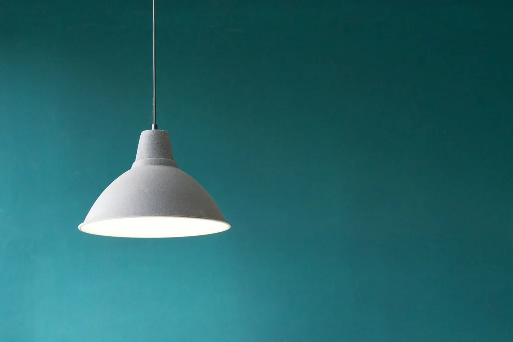 Modern pendant lighting in a calm interior setting — illustrative atmosphere only